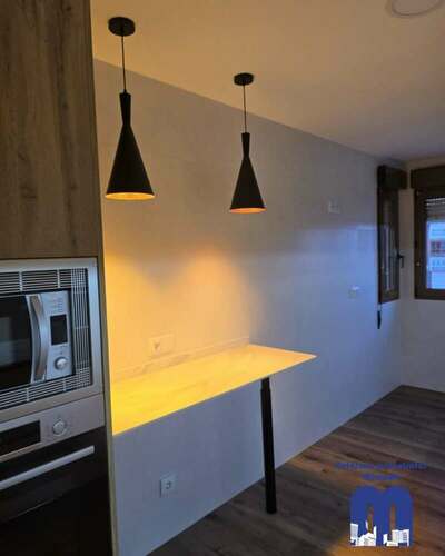 Reforma integral de piso con cocina moderna y baños renovados en Gijón